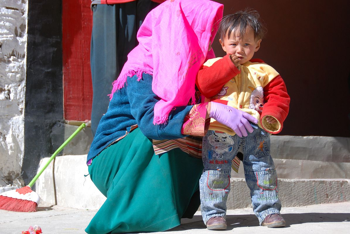 12 Tibetan Mother And Son Outside Chuku Nyenri Gompa On Mount Kailash Outer Kora A Tibetan mother and her son pose for me in front of the Chuku (Nyenri) Gompa